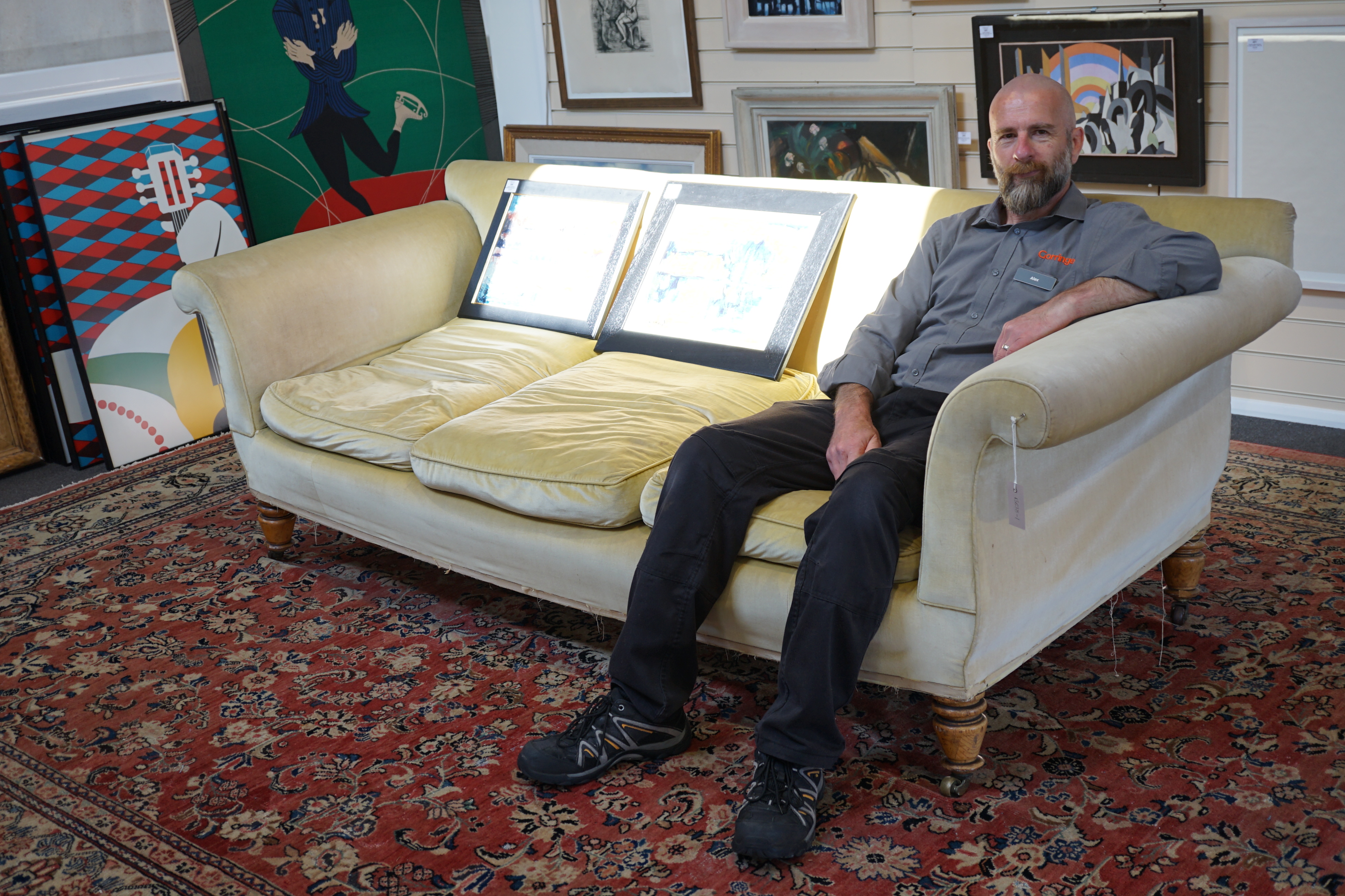 A large Victorian sofa, in the manner of Howard & Sons, probably Swietenia mahagoni with a Fagus sylvatica frame